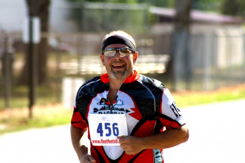 Mike runs in triathlon