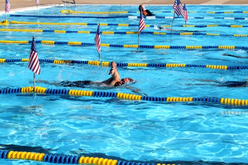 Chris swims in the triathlon